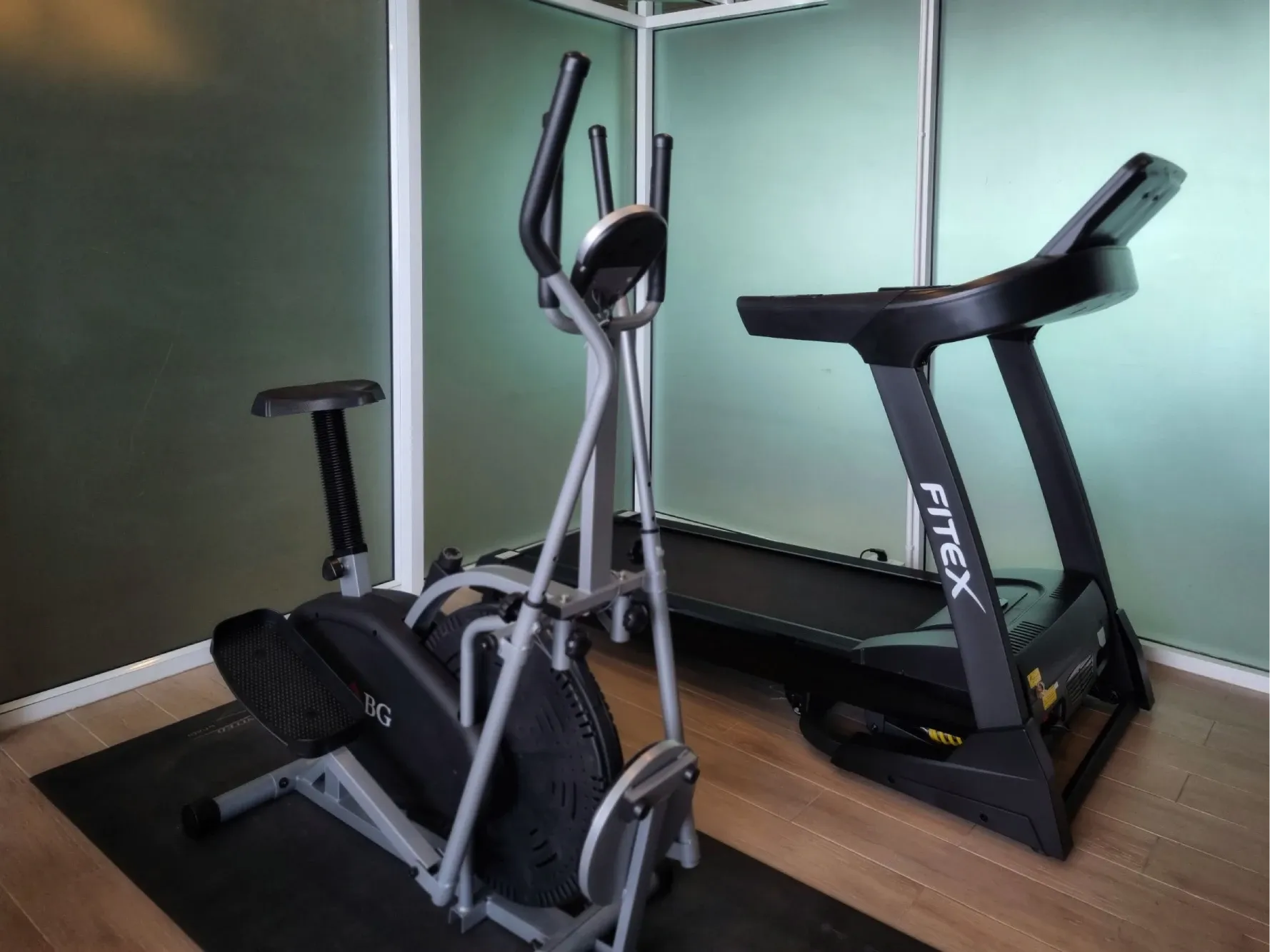 Treadmill and cross trainer in the fitness room at Arawana Regency Ratchada